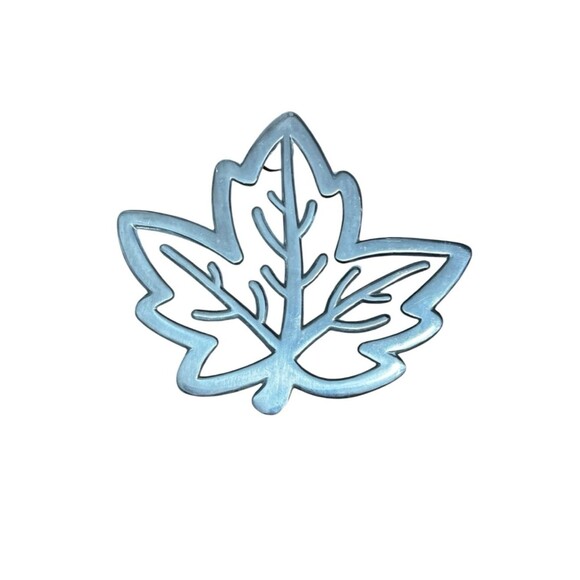 Copco Other - Copco cast aluminum heat resistant trivet featuring a maple leaf design.